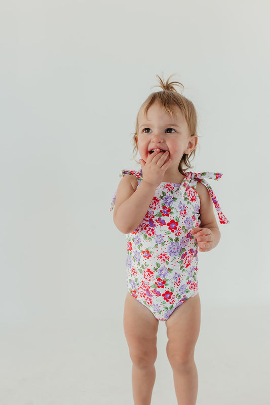 GIRLS TIE STRAP ONE PIECE IN CORAL BLOSSOM BY PINK DESERT X SARAH TRIPP