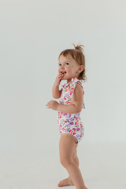 GIRLS TIE STRAP ONE PIECE IN CORAL BLOSSOM BY PINK DESERT X SARAH TRIPP