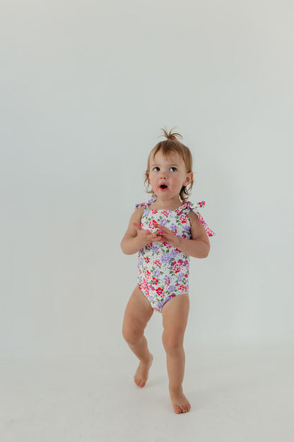 GIRLS TIE STRAP ONE PIECE IN CORAL BLOSSOM BY PINK DESERT X SARAH TRIPP
