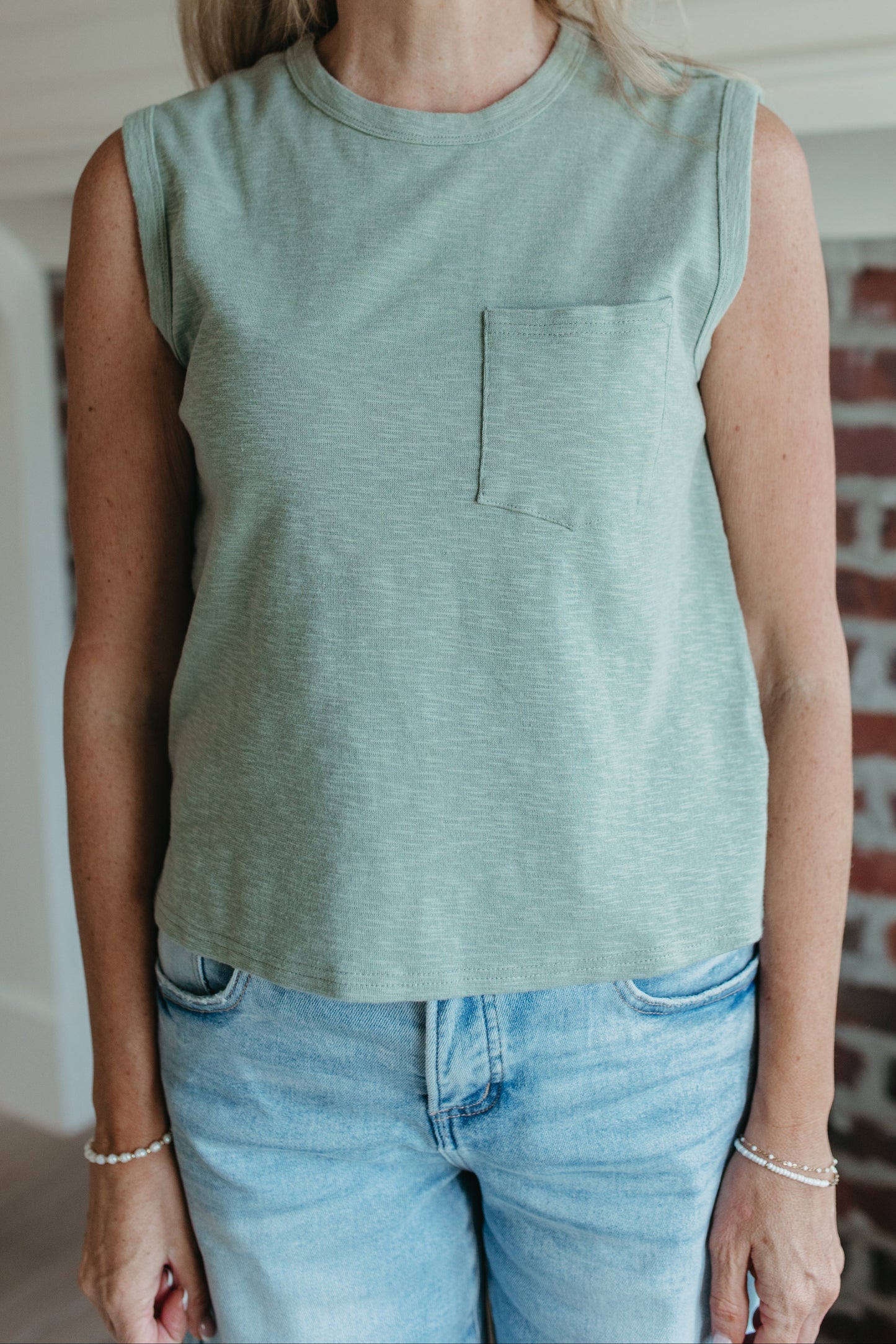 THE KHYLEE  SLEEVELESS COTTON TOP IN SAGE GREEN