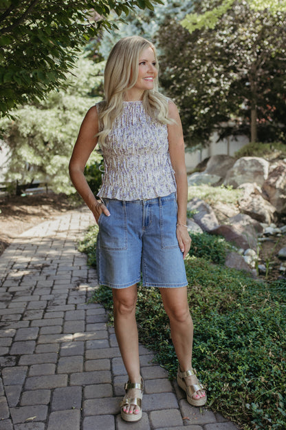 The Renata Floral Sleeveless Smocked Blouse in Lavender, photo 3 of 7