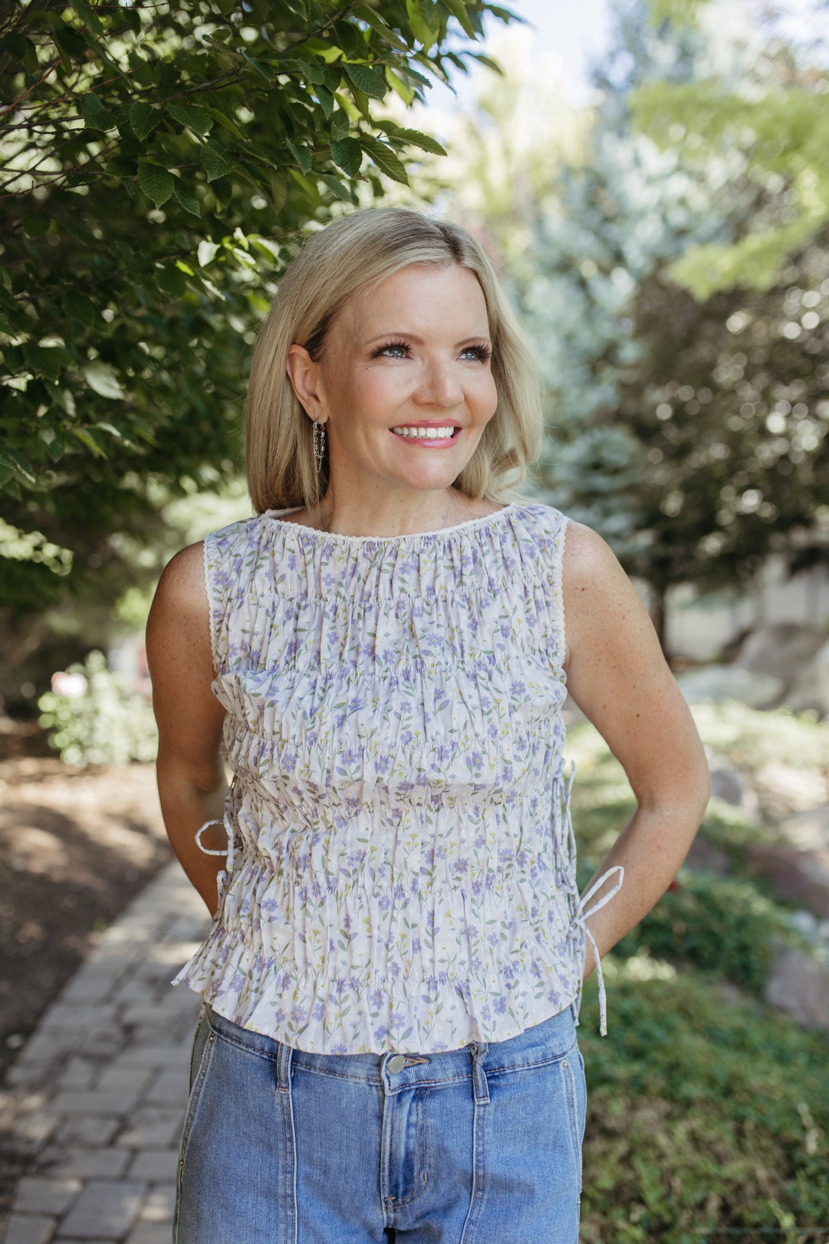 The Renata Floral Sleeveless Smocked Blouse in Lavender, photo 4 of 7