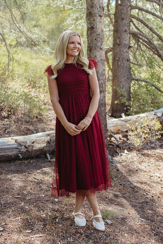 THE SEVYN POLKA DOT MIDI SMOCKED DRESS IN BURGUNDY