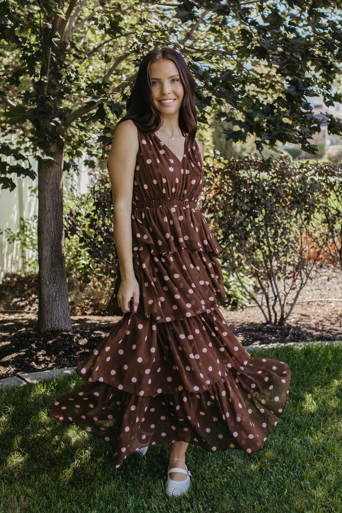 THE GRETA POLKA DOT TIERED SLEEVELESS DRESS IN BROWN