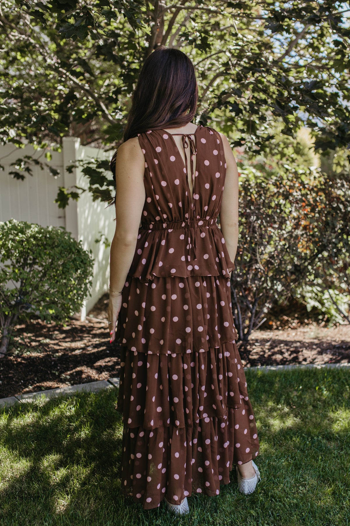 THE GRETA POLKA DOT TIERED SLEEVELESS DRESS IN BROWN