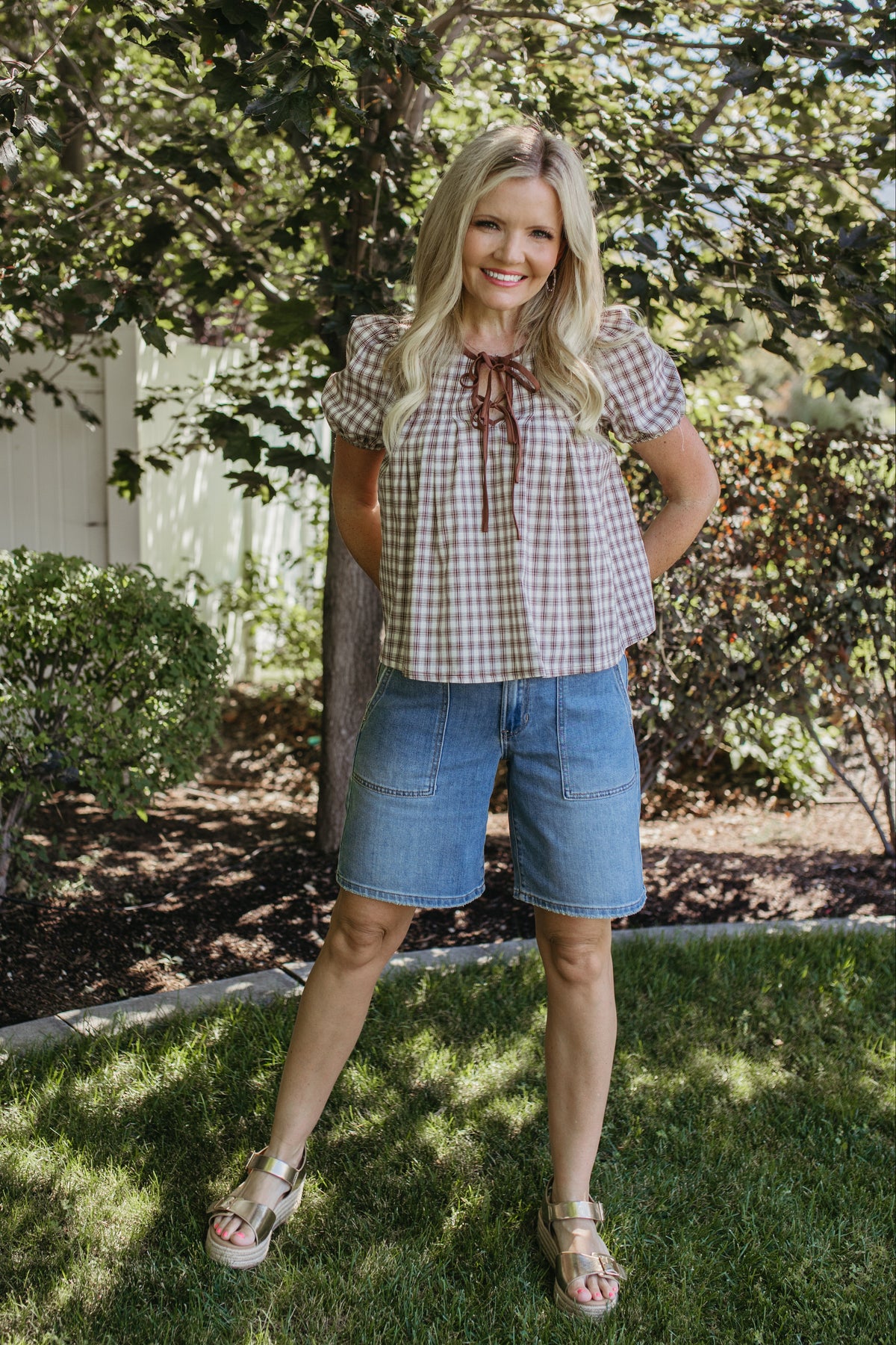 THE GIULIANA PLAID SHORT SLEEVE PINTUCK BLOUSE IN BROWN