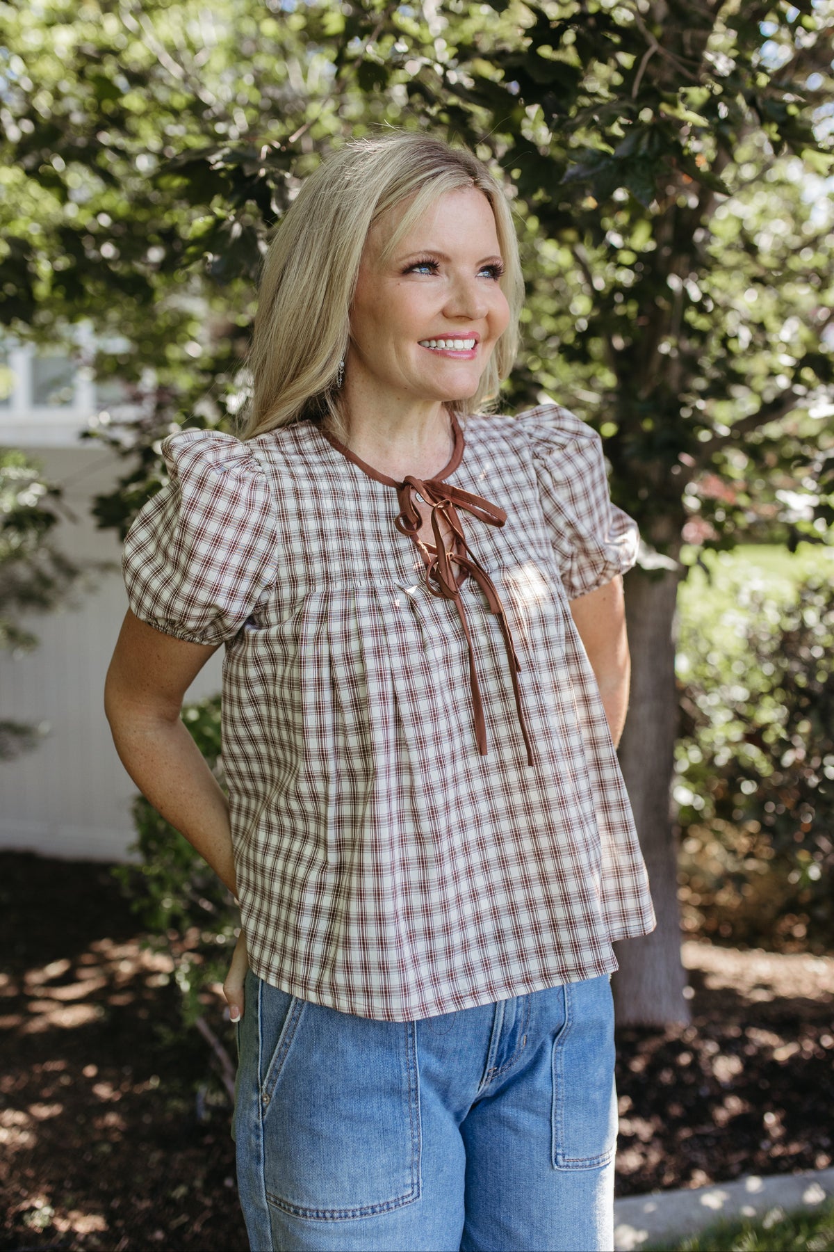 THE GIULIANA PLAID SHORT SLEEVE PINTUCK BLOUSE IN BROWN