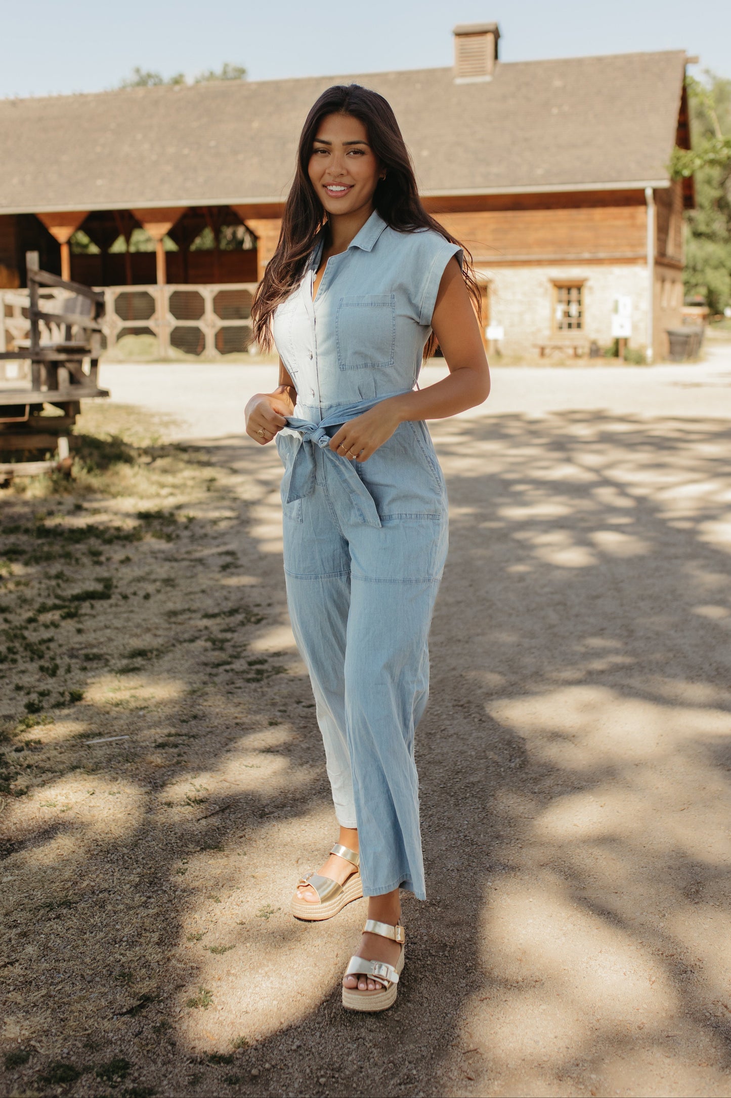 THE GEORGIA BELTED JUMPSUIT IN LIGHT DENIM