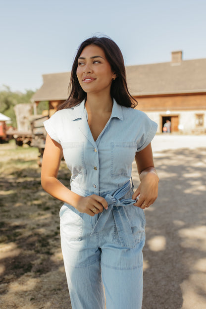 THE GEORGIA BELTED JUMPSUIT IN LIGHT DENIM