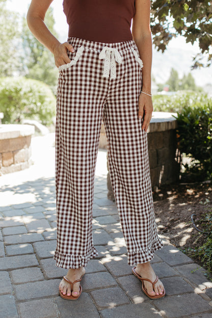 THE RAYNE GINGHAM RUFFLED PANTS IN BROWN