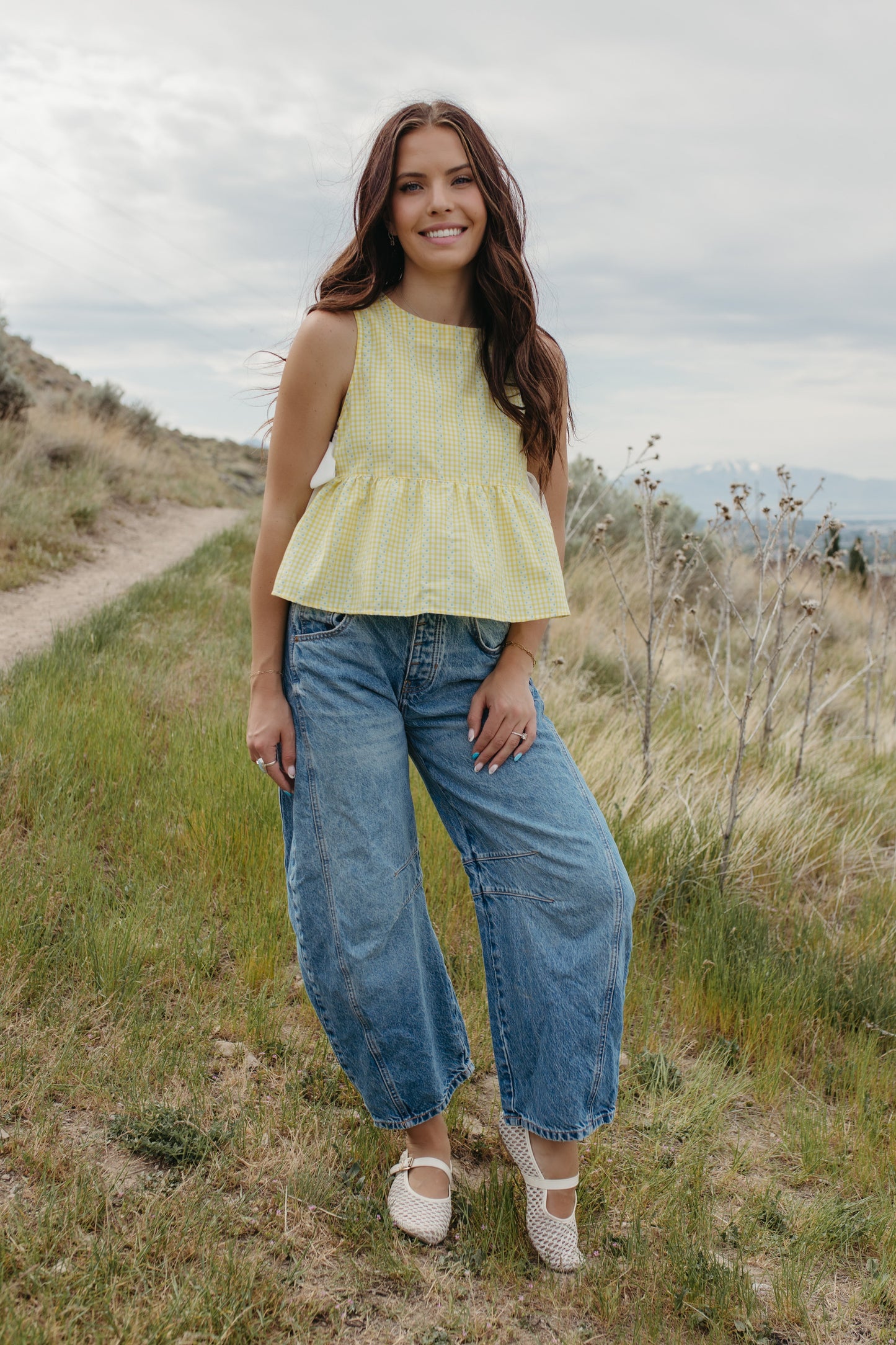THE EVIE SKY MEADOW PEPLUM TOP IN YELLOW