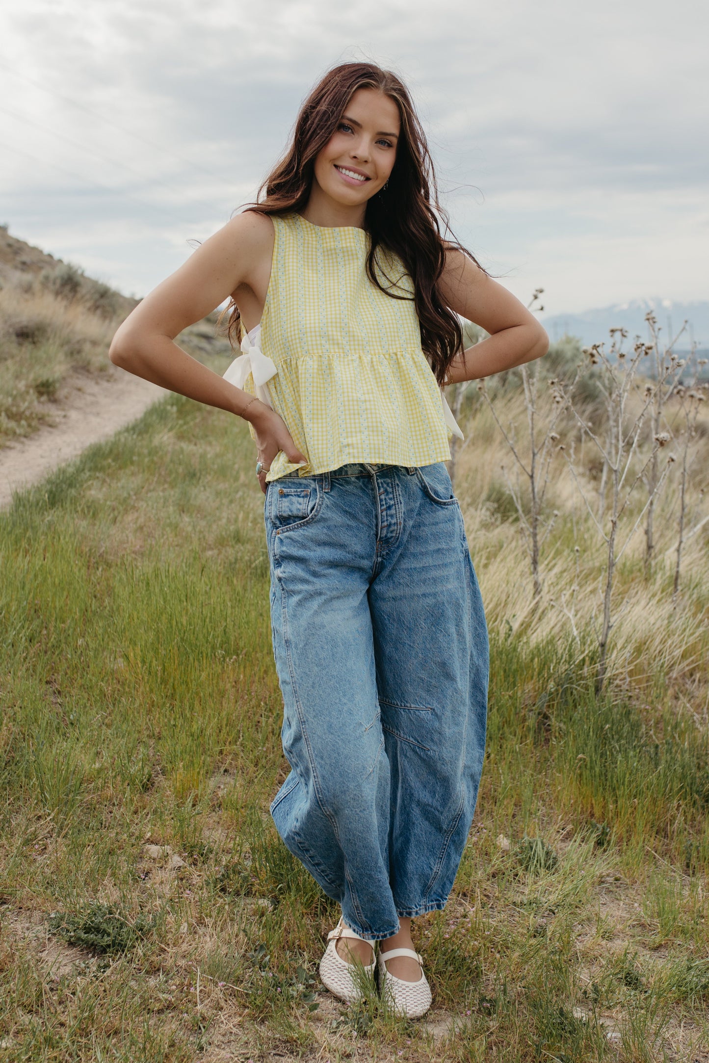 THE EVIE SKY MEADOW PEPLUM TOP IN YELLOW