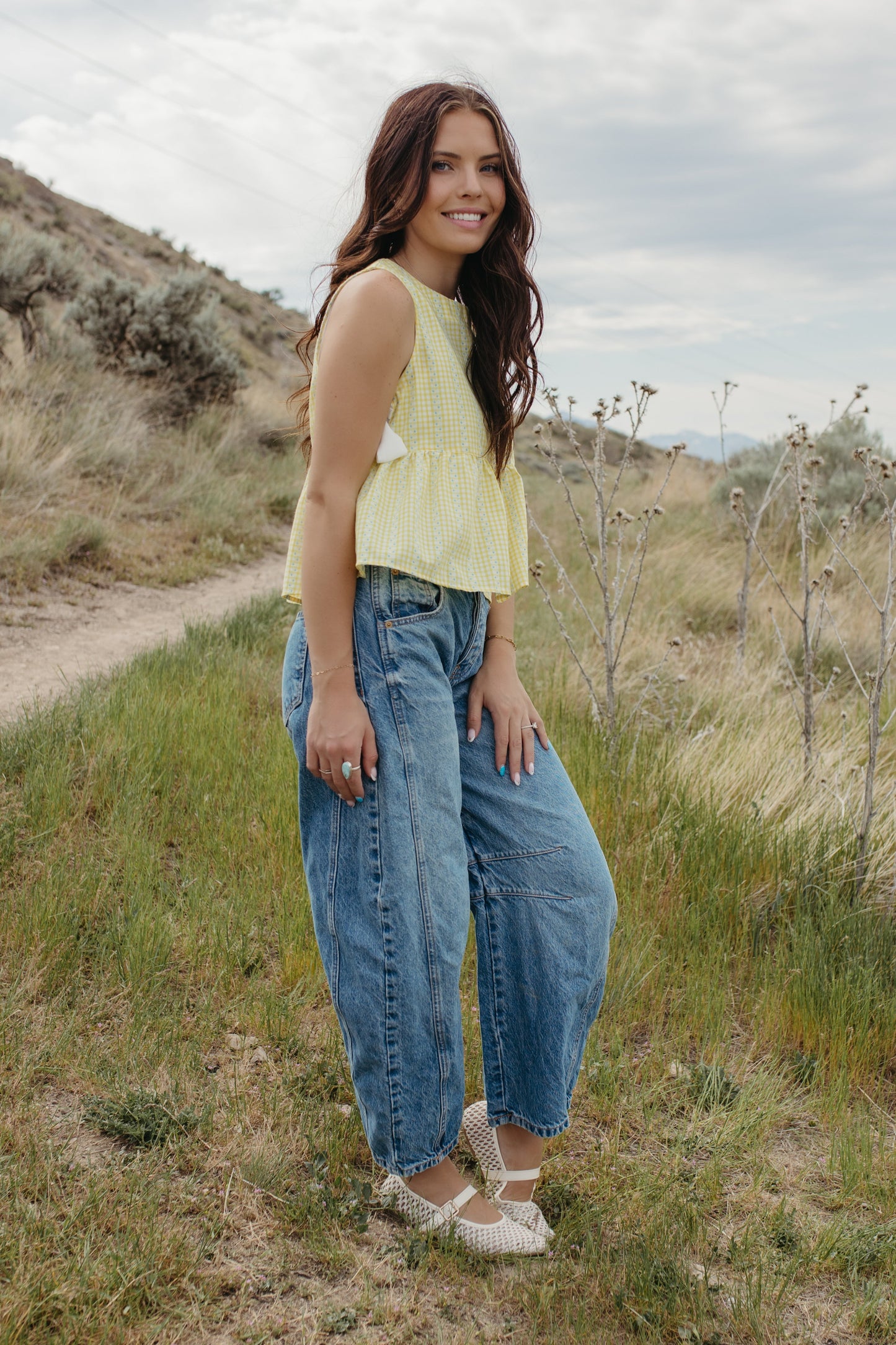 THE EVIE SKY MEADOW PEPLUM TOP IN YELLOW
