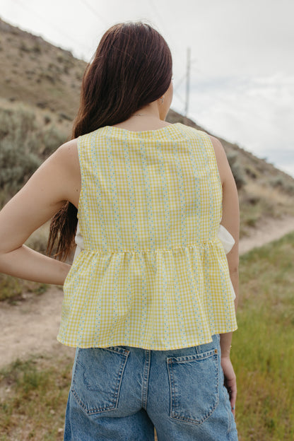 THE EVIE SKY MEADOW PEPLUM TOP IN YELLOW