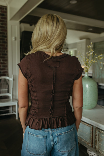 THE CLAUDIA RUCHED RUFFLED HEM TOP IN BROWN