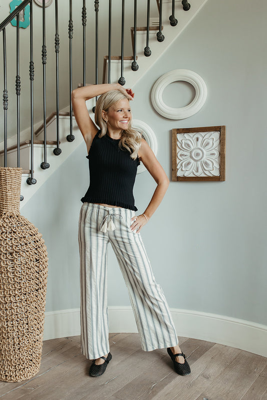 THE REMI SLEEVELESS FRILL TOP IN BLACK