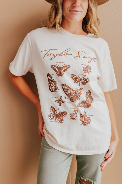 THE BUTTERFLY ERAS TEE IN IVORY BY PINK DESERT