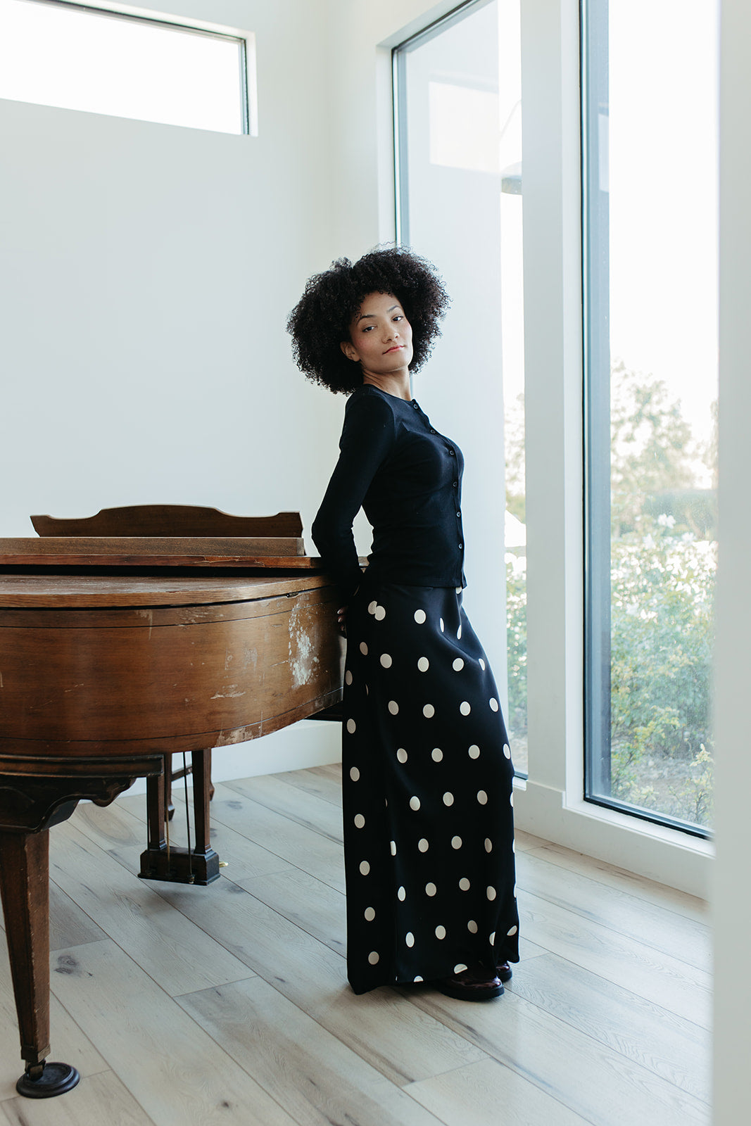 THE OAKLYNN POLKA DOT SATIN SKIRT IN BLACK