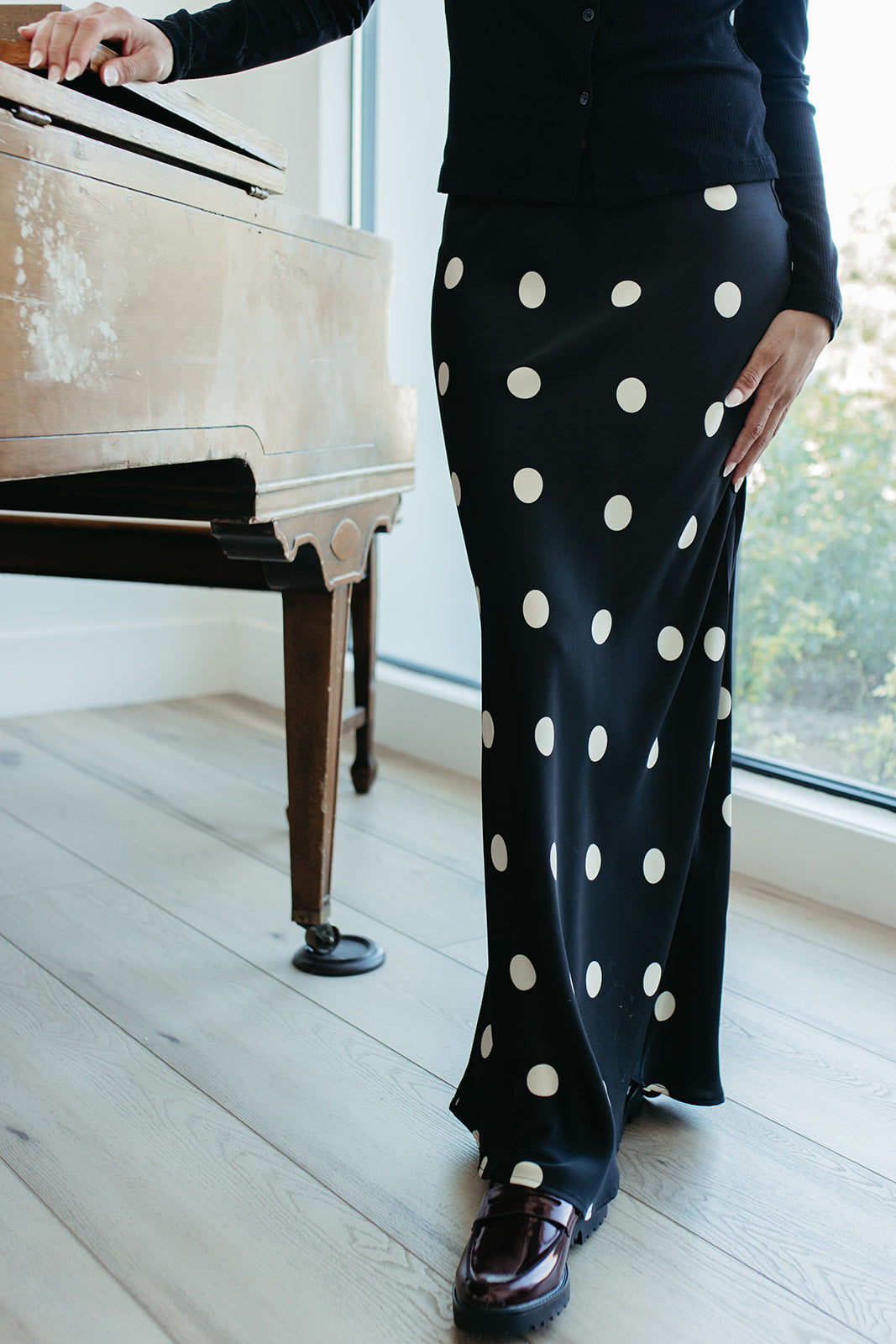 THE OAKLYNN POLKA DOT SATIN SKIRT IN BLACK