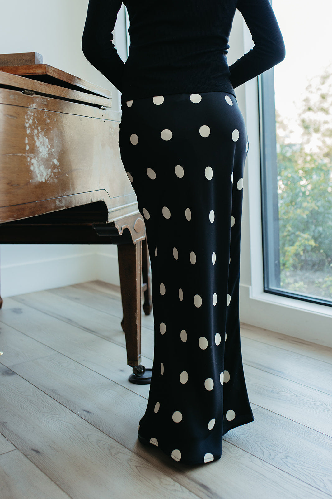 THE OAKLYNN POLKA DOT SATIN SKIRT IN BLACK