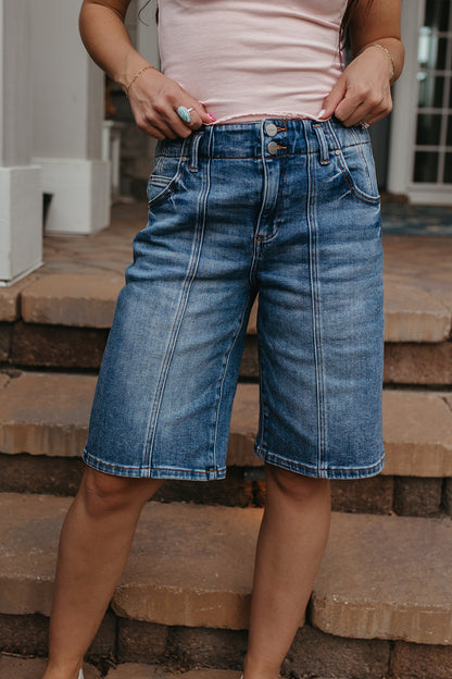 THE OLIVE SLOUCHY BERMUDA SHORTS IN MEDIUM WASH