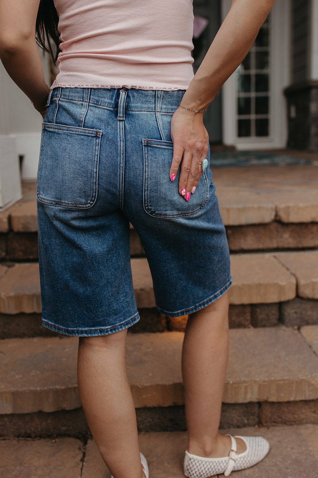 THE OLIVE SLOUCHY BERMUDA SHORTS IN MEDIUM WASH