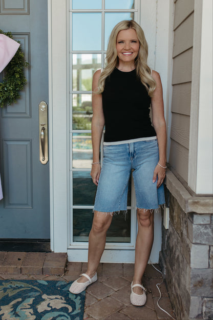 THE GRACELYNN SLEEVELESS SWEATER IN BLACK