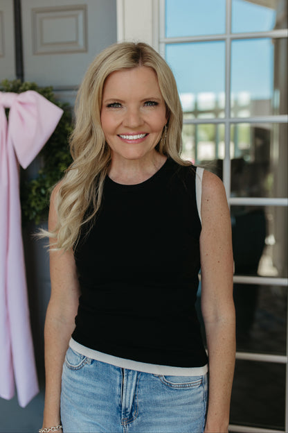 THE GRACELYNN SLEEVELESS SWEATER IN BLACK