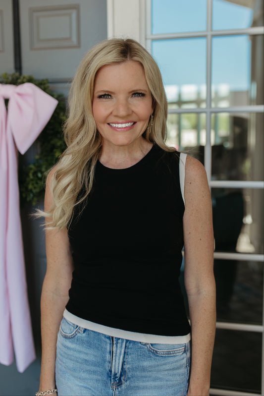THE GRACELYNN SLEEVELESS SWEATER IN BLACK