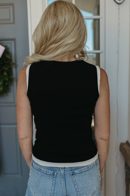 THE GRACELYNN SLEEVELESS SWEATER IN BLACK