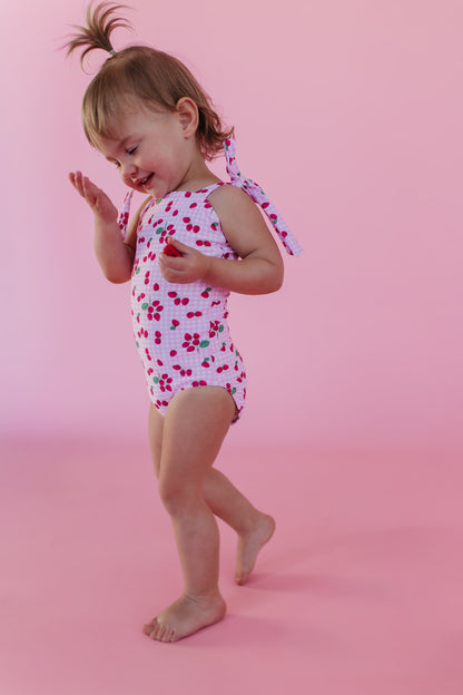 GIRLS TIE STRAP ONE PIECE IN ROSIE RASPBERRY BY PINK DESERT