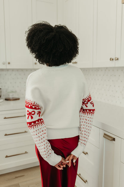 THE HARTLEE BOW SWEATER IN CREAM