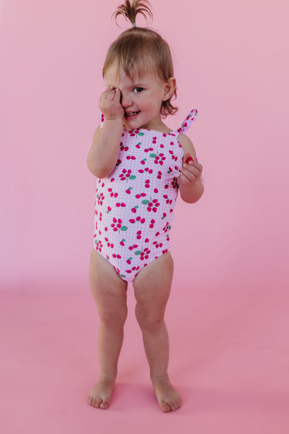 GIRLS TIE STRAP ONE PIECE IN ROSIE RASPBERRY BY PINK DESERT