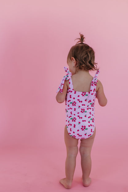 GIRLS TIE STRAP ONE PIECE IN ROSIE RASPBERRY BY PINK DESERT