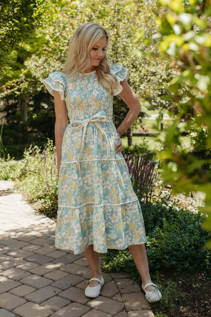 THE CALI FLORAL RUFFLED DRESS IN BLUE