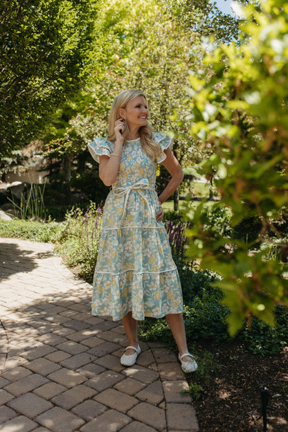 THE CALI FLORAL RUFFLED DRESS IN BLUE