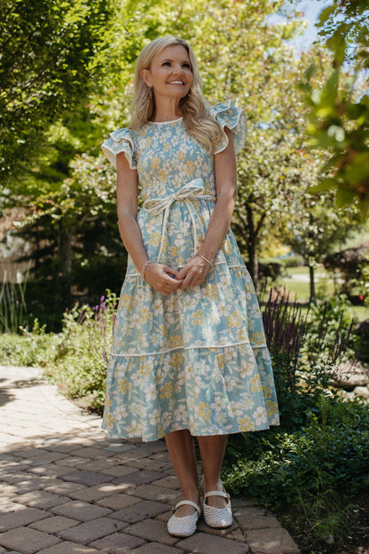 THE CALI FLORAL RUFFLED DRESS IN BLUE