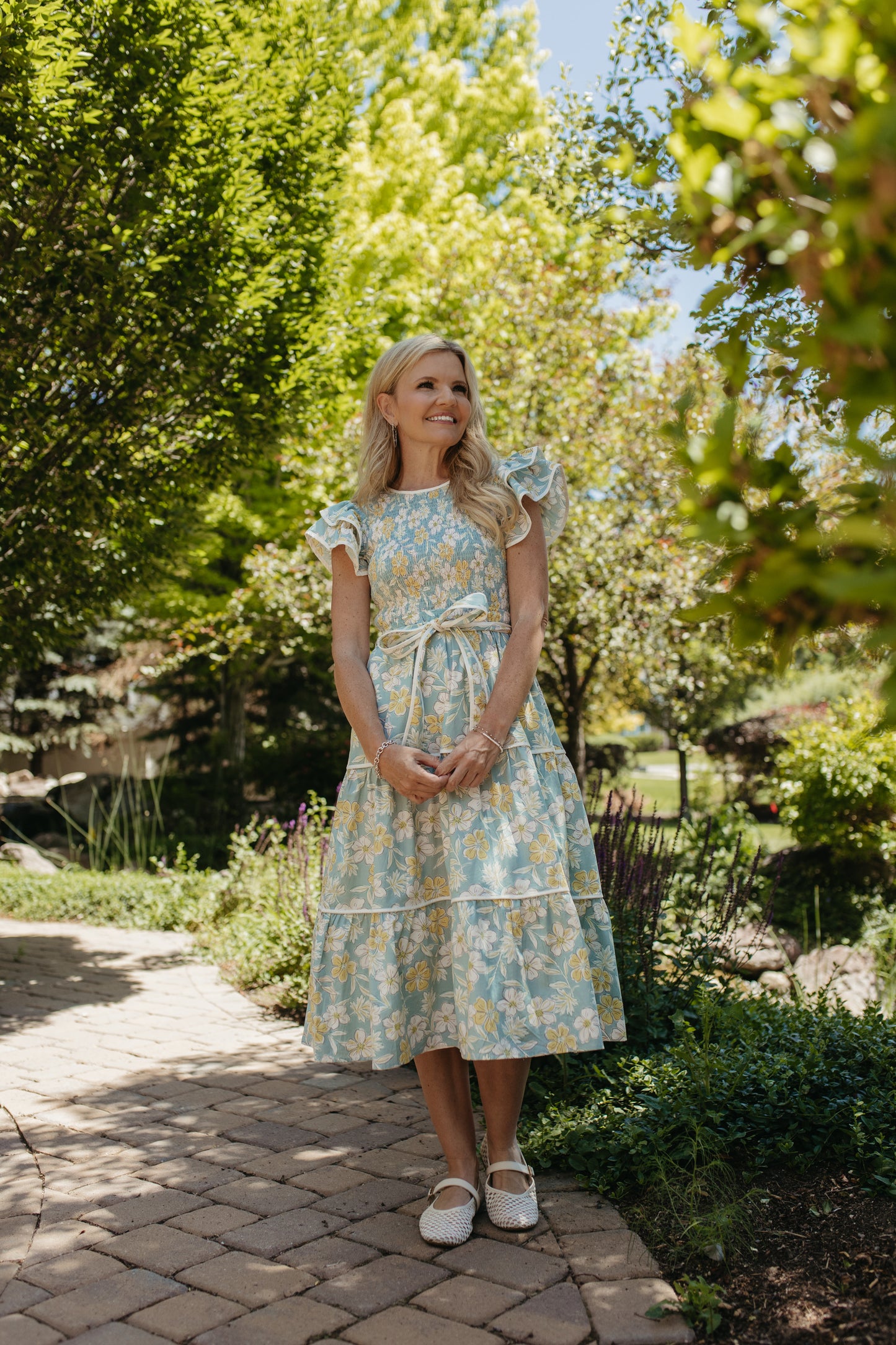 THE CALI FLORAL RUFFLED DRESS IN BLUE