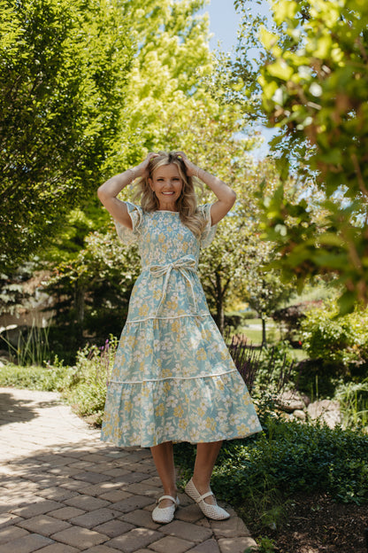 THE CALI FLORAL RUFFLED DRESS IN BLUE