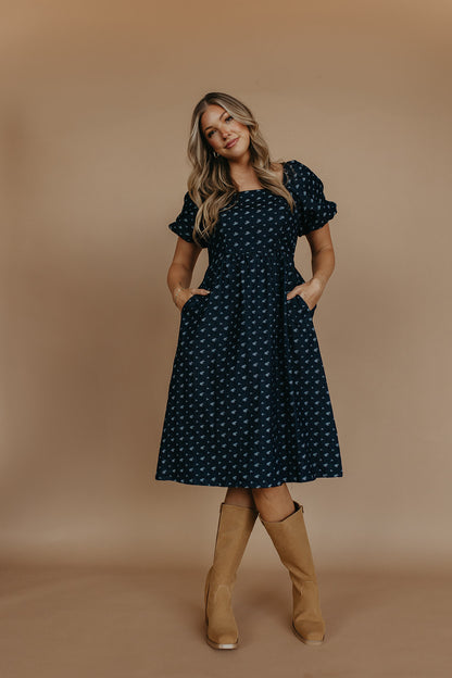 THE MAKENZIE FLORAL JACQUARD DENIM DRESS IN BLUE
