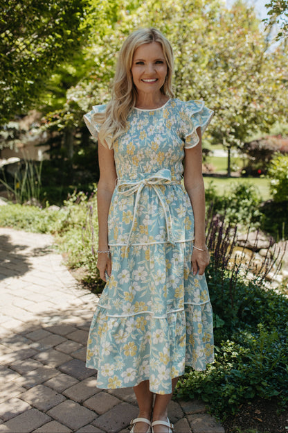 THE CALI FLORAL RUFFLED DRESS IN BLUE