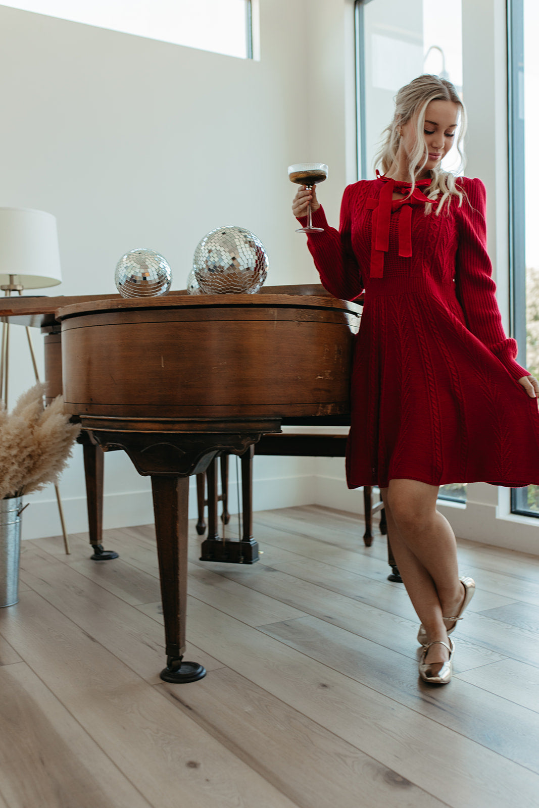 THE NOELLE VELVET BOW SWEATER DRESS IN RED