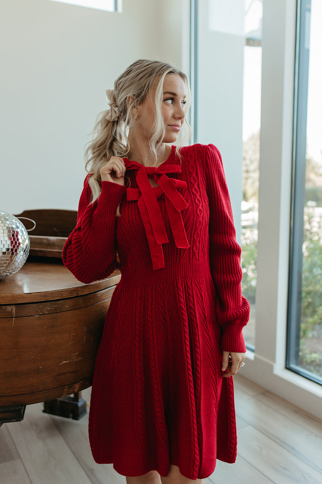 THE NOELLE VELVET BOW SWEATER DRESS IN RED