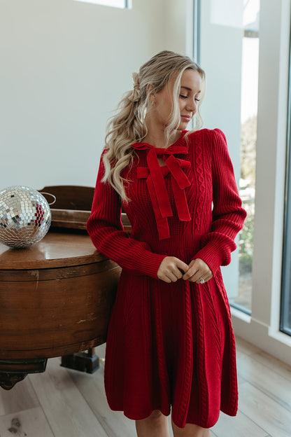 THE NOELLE VELVET BOW SWEATER DRESS IN RED