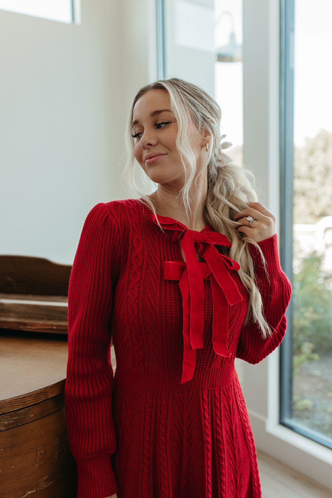 THE NOELLE VELVET BOW SWEATER DRESS IN RED