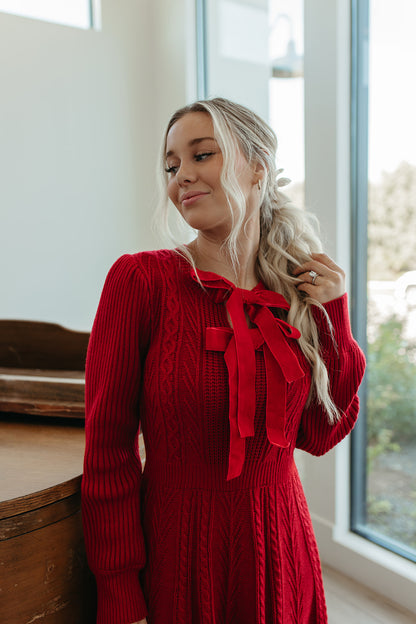 THE NOELLE VELVET BOW SWEATER DRESS IN RED