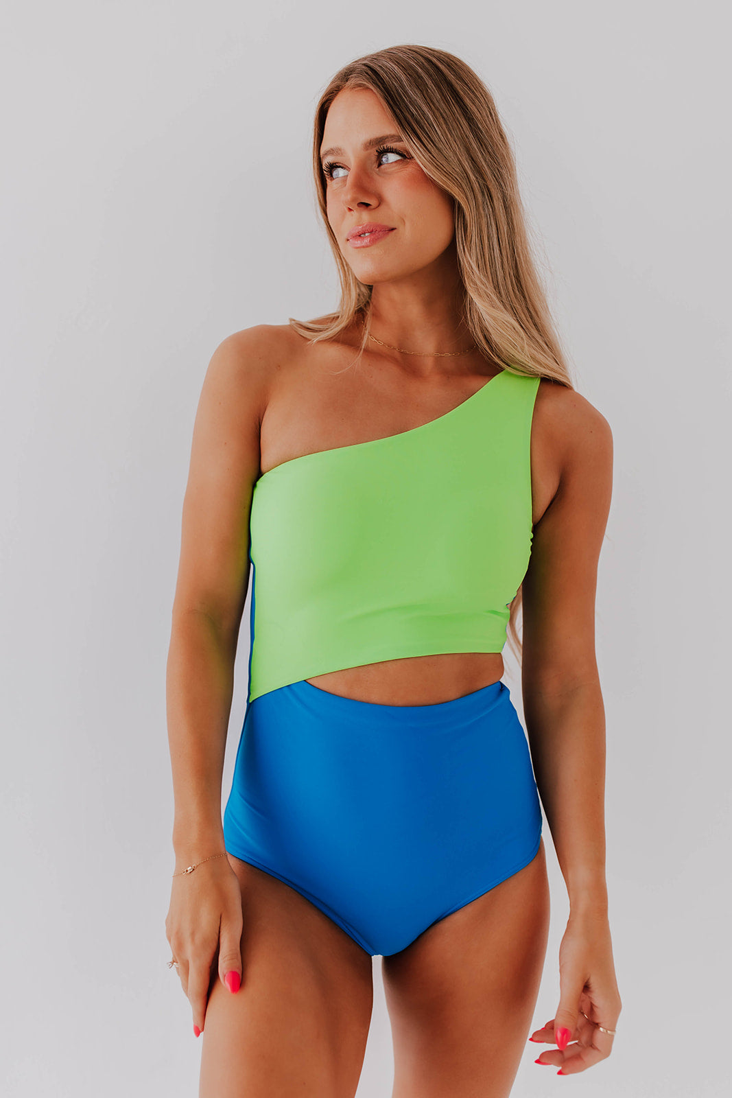 Blue one-piece swimsuit with tight push-up bust and low-cut bikini