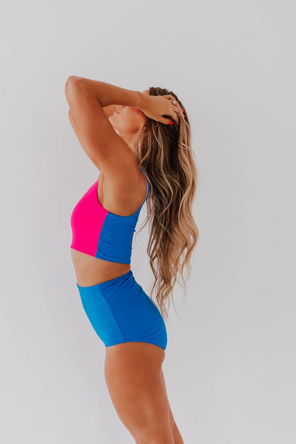 HARPER CUT OUT ONE PIECE IN NEON BLUE AND PINK COLOR BLOCK BY BETSY MIKESELL X PINK DESERT