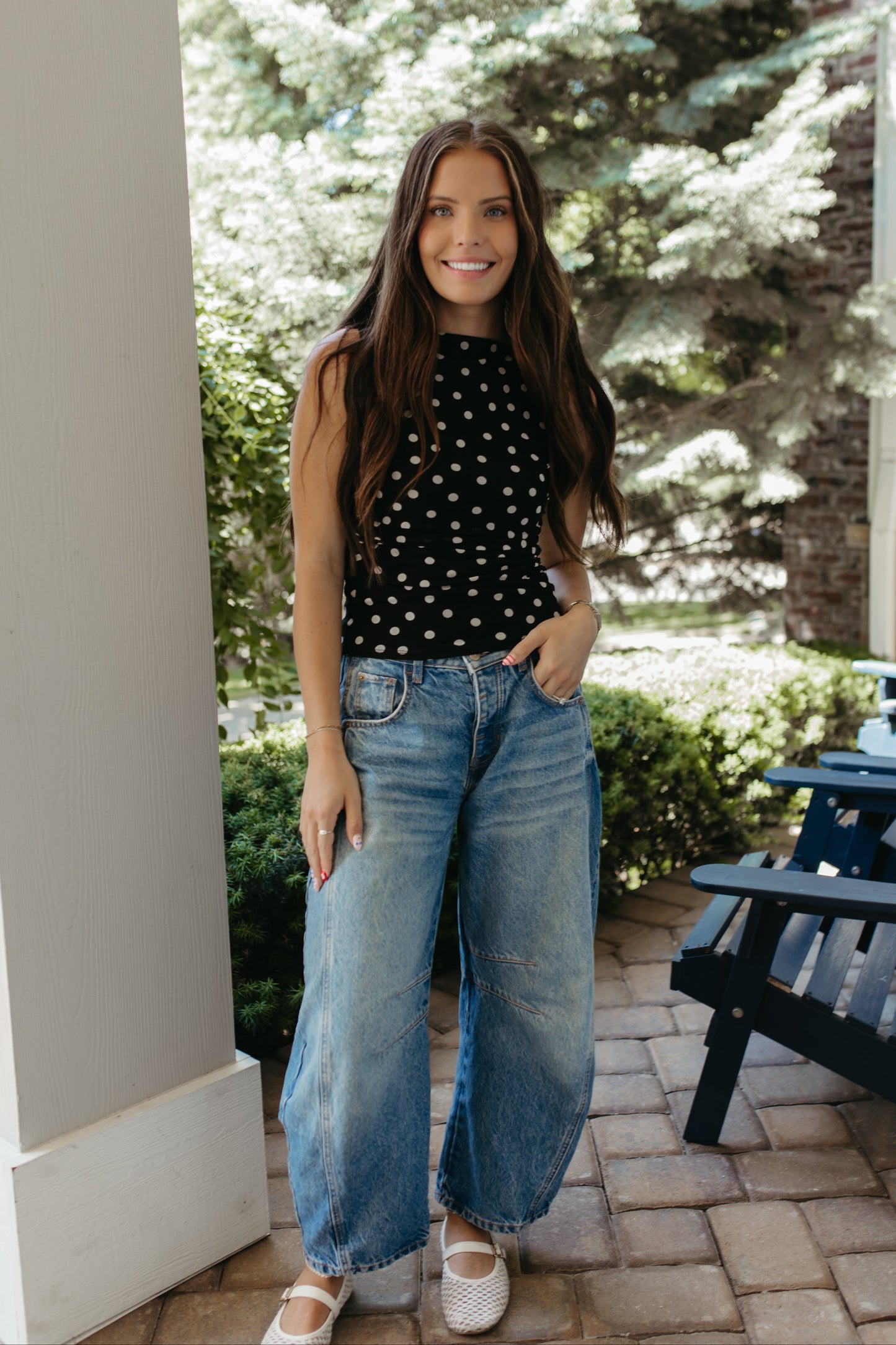 THE AINARA POLKA DOT SLEEVELESS KNIT TOP IN BLACK