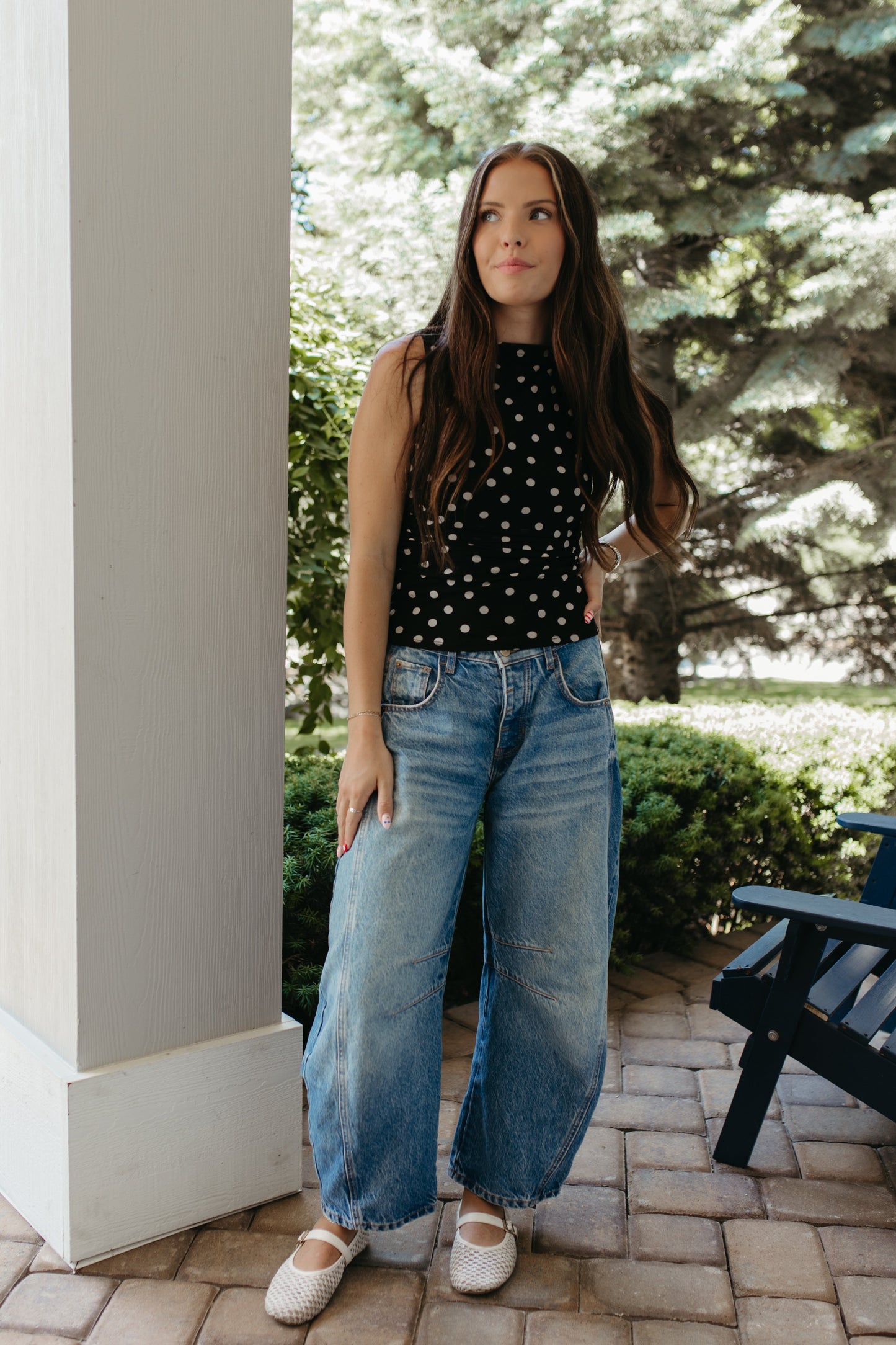 THE AINARA POLKA DOT SLEEVELESS KNIT TOP IN BLACK